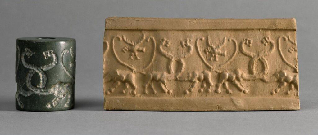 Sceau gravé en creux permettant de dérouler un motif sur l'argile, représentant des couples de lions et des aigles à tête de lion